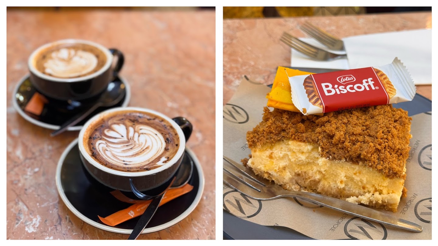 Two frames side by side. On the left, two black cups of coffee with poured latte art on a pink marble table. On the right, a slice with a crumb top and a pale set centre on a Metropole napkin, with a wrapped Lotus Biscoff biscuit resting on it and two forks alongside.